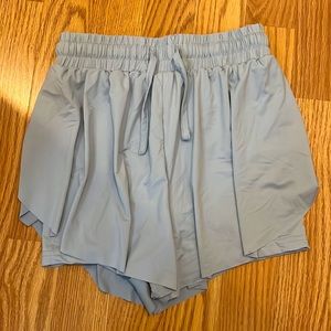 AS REVIVAL/ Arula Heidi Pleated Satin Shorts in Light Blue